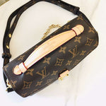 Louis Vuitton Crossbody Bag with a Side Slot for Storing Cards.