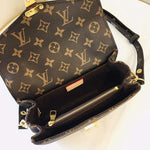Louis Vuitton Crossbody Bag with a Side Slot for Storing Cards.