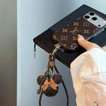 Luxury Monogram Case with Bow Charm & Wrist Lanyard for iPhone 12-18 Pro & Pro Max
