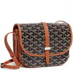 Luxury Goyardine canvas saddle crossbody bag in black with tan trim